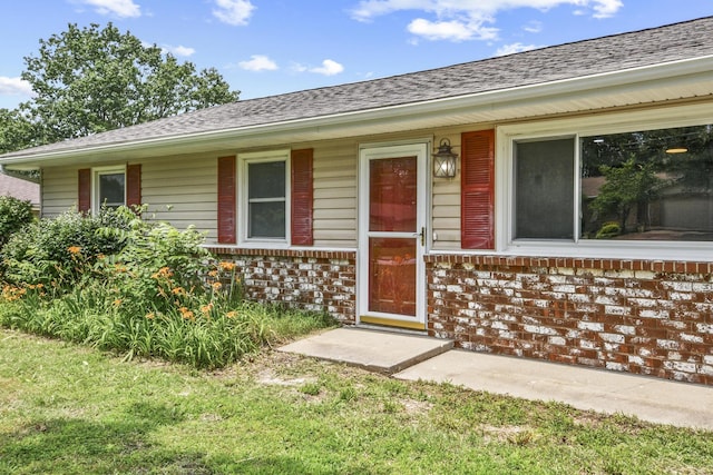 7047 W Lone Oak St, Springfield, MO 65803 - view of exterior entry with brick siding and a shingled roof
