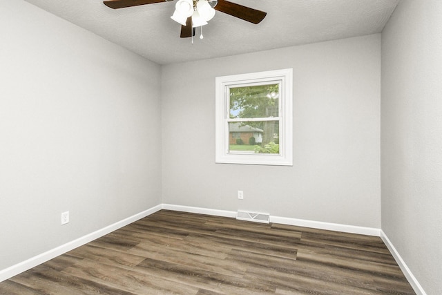 7047 W Lone Oak St, Springfield, MO 65803 - unfurnished room with ceiling fan and dark wood-type flooring