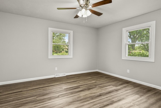 7047 W Lone Oak St, Springfield, MO 65803 - unfurnished room with wood finished floors and a ceiling fan