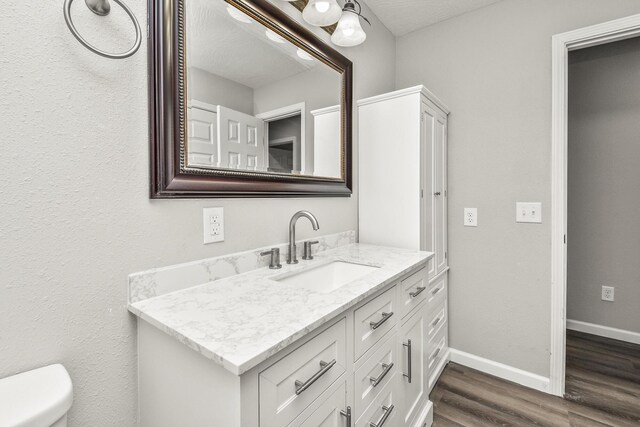 7047 W Lone Oak St, Springfield, MO 65803 - bathroom featuring vanity and wood finished floors