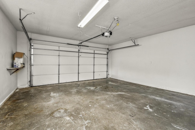 7047 W Lone Oak St, Springfield, MO 65803 - garage with a garage door opener and baseboards