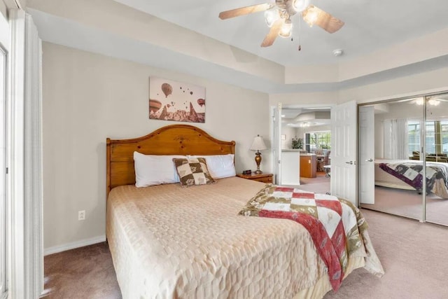 200 Glory Rd Unit B6, Branson, MO 65616 - carpeted bedroom featuring multiple windows, a closet, and a ceiling fan