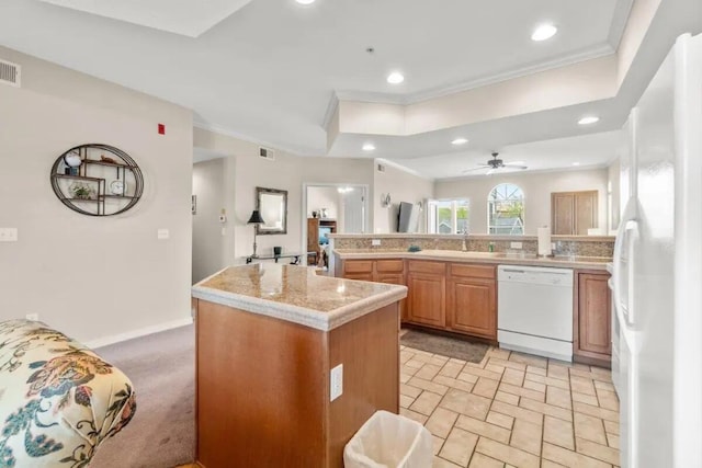 200 Glory Rd Unit B6, Branson, MO 65616 - kitchen featuring white appliances, crown molding, light countertops, recessed lighting, and a kitchen island