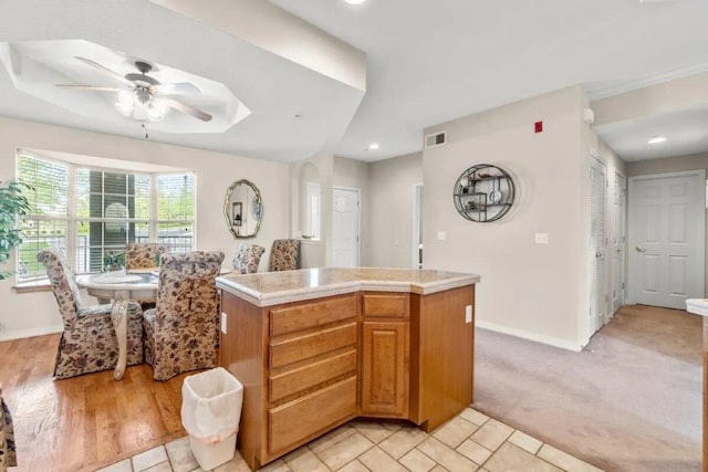 200 Glory Rd Unit B6, Branson, MO 65616 - kitchen with ceiling fan, light countertops, recessed lighting, and a center island