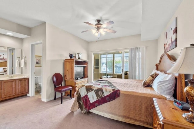 200 Glory Rd Unit B6, Branson, MO 65616 - bedroom with light colored carpet, ensuite bathroom, and ceiling fan