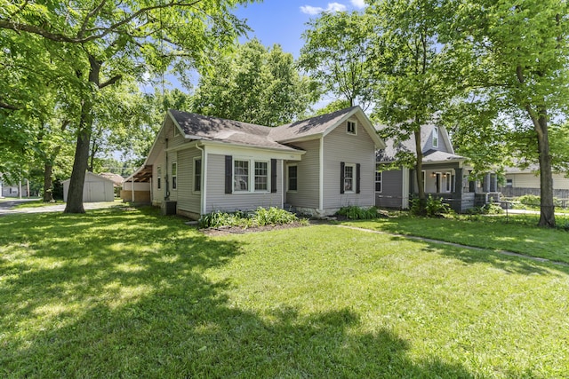 922 W Elm St, Springfield, MO 65806 - view of front of property featuring a shingled roof and a storage shed