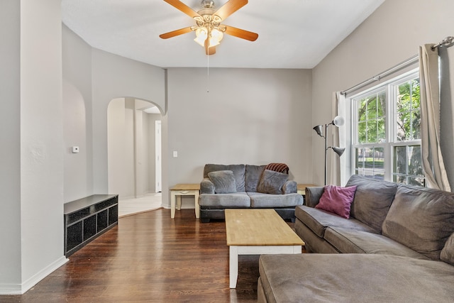 922 W Elm St, Springfield, MO 65806 - living room with arched walkways, dark wood finished floors, and a ceiling fan