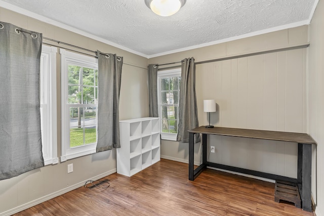 922 W Elm St, Springfield, MO 65806 - unfurnished office featuring wood finished floors, healthy amount of natural light, a textured ceiling, and ornamental molding