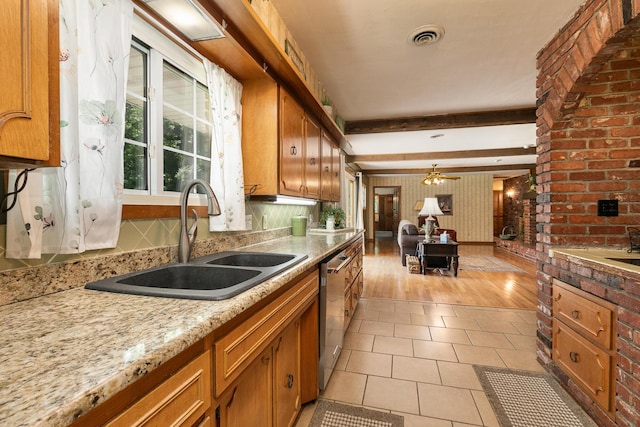424 W Olive St, Bolivar, MO 65613 - kitchen featuring brown cabinets, stainless steel dishwasher, light tile patterned floors, and beam ceiling