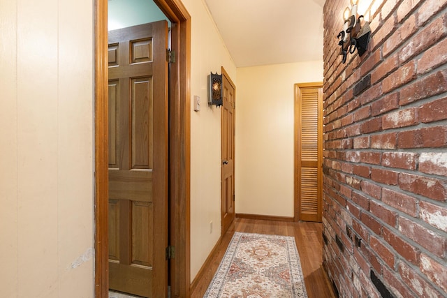 424 W Olive St, Bolivar, MO 65613 - hallway with wood finished floors and baseboards