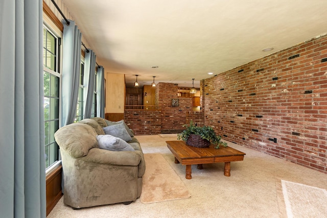 424 W Olive St, Bolivar, MO 65613 - living room featuring brick wall and carpet floors