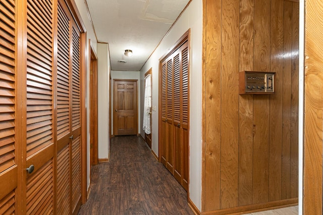 424 W Olive St, Bolivar, MO 65613 - hall featuring dark wood-type flooring and baseboards