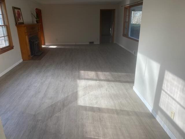2166 S Lone Pine Ave, Springfield, MO 65804 - unfurnished living room with a fireplace with flush hearth and wood finished floors