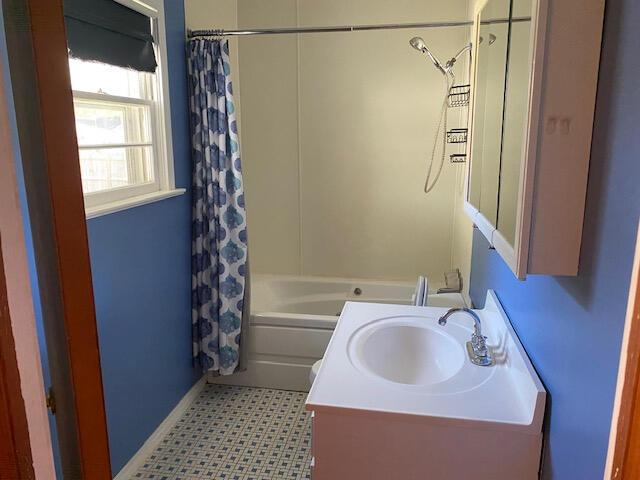 2166 S Lone Pine Ave, Springfield, MO 65804 - full bathroom featuring shower / bath combination with curtain, vanity, and tile patterned floors