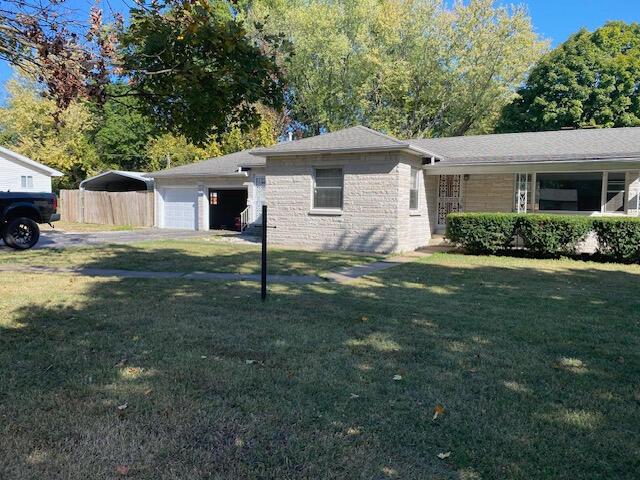2166 S Lone Pine Ave, Springfield, MO 65804 - view of front of home featuring an attached garage and brick siding