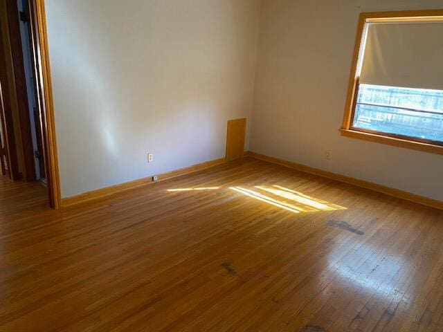 2166 S Lone Pine Ave, Springfield, MO 65804 - empty room featuring baseboards and wood finished floors
