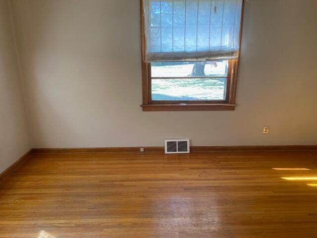 2166 S Lone Pine Ave, Springfield, MO 65804 - spare room with wood finished floors and baseboards
