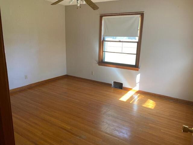 2166 S Lone Pine Ave, Springfield, MO 65804 - unfurnished room featuring wood finished floors and ceiling fan