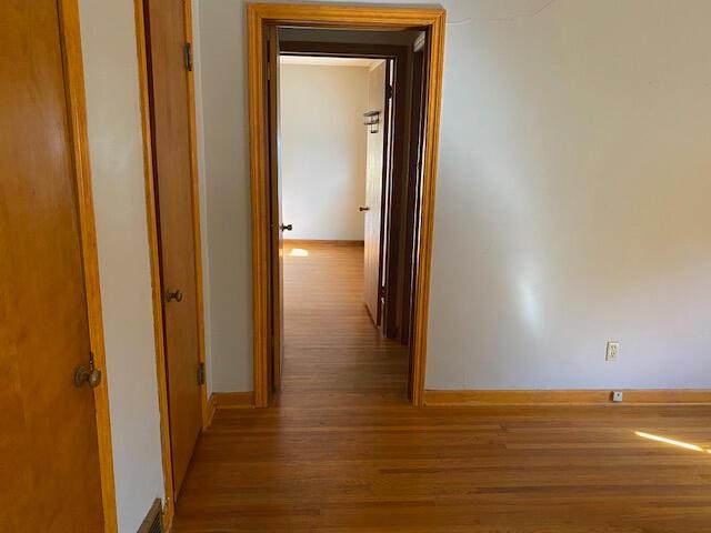 2166 S Lone Pine Ave, Springfield, MO 65804 - corridor featuring wood finished floors and baseboards