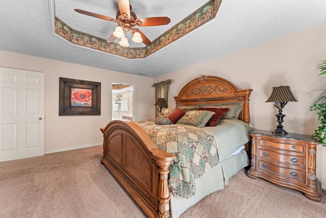 200 Eagle Pointe Dr, Branson, MO 65616 - bedroom featuring light carpet, a raised ceiling, connected bathroom, and ceiling fan