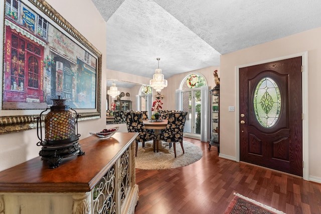 200 Eagle Pointe Dr, Branson, MO 65616 - foyer entrance with a chandelier, dark wood-type flooring, and a textured ceiling