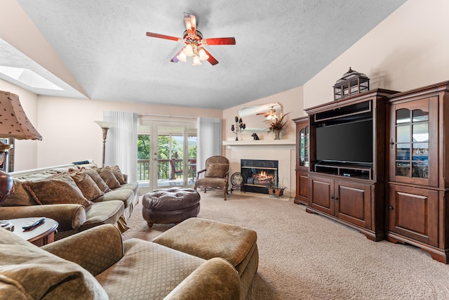 200 Eagle Pointe Dr, Branson, MO 65616 - living area with lofted ceiling, light carpet, a textured ceiling, a tiled fireplace, and ceiling fan