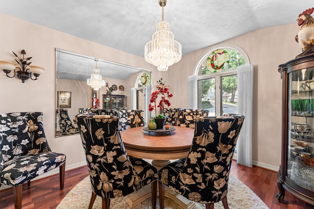 200 Eagle Pointe Dr, Branson, MO 65616 - dining room featuring a chandelier, wood finished floors, and a textured ceiling