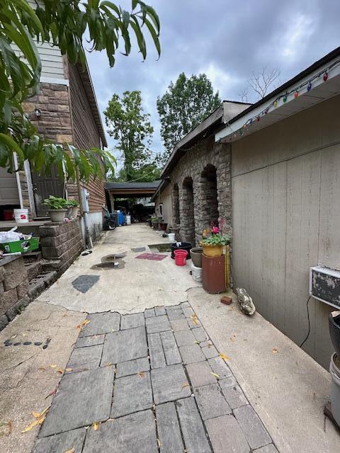 3200 Driftwood Rd, Merriam Woods, MO 65740 - view of patio / terrace with concrete driveway