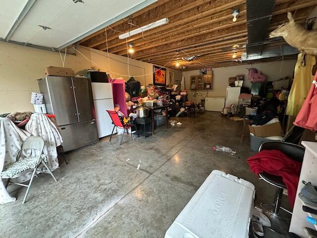 3200 Driftwood Rd, Merriam Woods, MO 65740 - below grade area featuring freestanding refrigerator