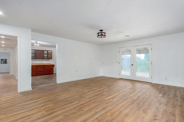 119 E Mill St, Republic, MO 65738 - unfurnished room with light wood-type flooring, recessed lighting, and french doors