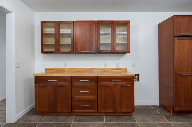 119 E Mill St, Republic, MO 65738 - kitchen with glass insert cabinets and dark tile patterned floors