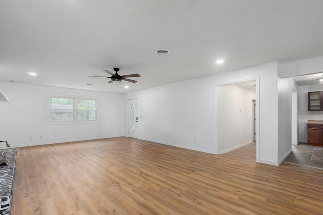 119 E Mill St, Republic, MO 65738 - unfurnished living room featuring light wood-style flooring, a ceiling fan, and recessed lighting
