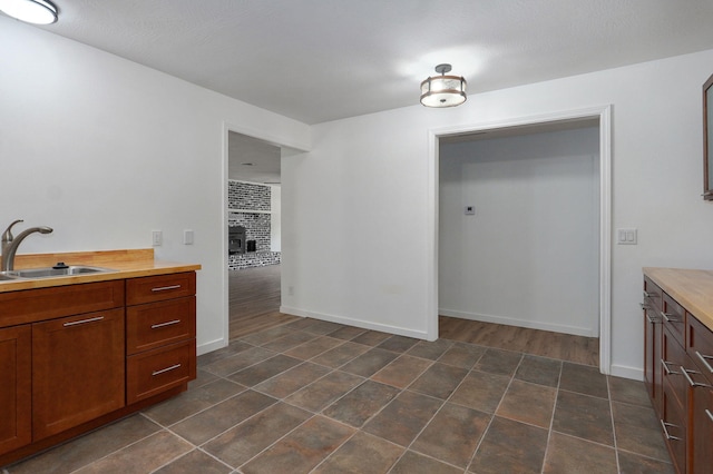 119 E Mill St, Republic, MO 65738 - bathroom featuring a sink and tile patterned floors