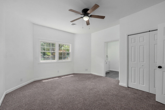 119 E Mill St, Republic, MO 65738 - unfurnished bedroom featuring dark colored carpet, a closet, ceiling fan, and connected bathroom