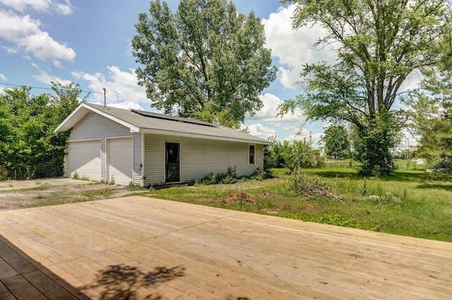119 E Mill St, Republic, MO 65738 - view of front of property with roof mounted solar panels and a garage