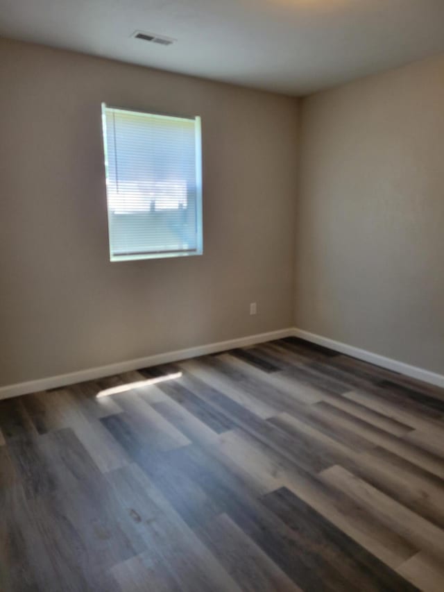 809 Elm Ave, Ava, MO 65608 - empty room with dark wood finished floors