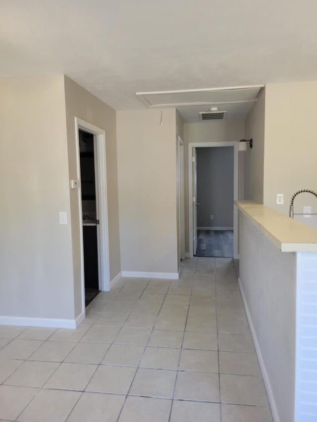 809 Elm Ave, Ava, MO 65608 - corridor featuring attic access and light tile patterned flooring