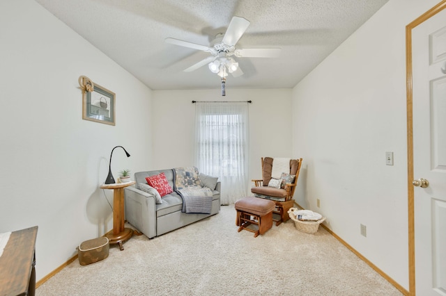 202 N Harper Ave, Springfield, MO 65802 - living area with carpet floors, a ceiling fan, and a textured ceiling