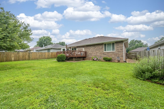 202 N Harper Ave, Springfield, MO 65802 - rear view of house featuring brick siding, a fenced backyard, a deck, and roof with shingles