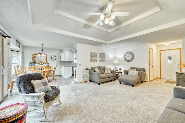 202 N Harper Ave, Springfield, MO 65802 - living room with a raised ceiling, a ceiling fan, and a textured ceiling