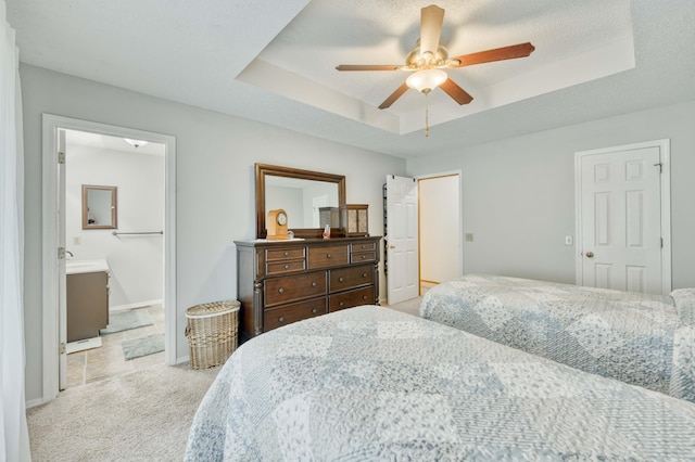 202 N Harper Ave, Springfield, MO 65802 - bedroom featuring light carpet, a raised ceiling, a ceiling fan, and ensuite bathroom
