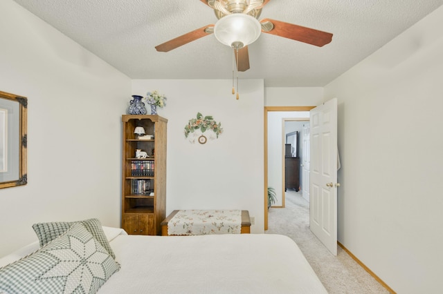 202 N Harper Ave, Springfield, MO 65802 - bedroom featuring light colored carpet, a textured ceiling, and ceiling fan