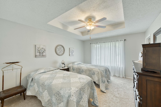 202 N Harper Ave, Springfield, MO 65802 - bedroom with light carpet, multiple windows, a raised ceiling, a textured ceiling, and a ceiling fan