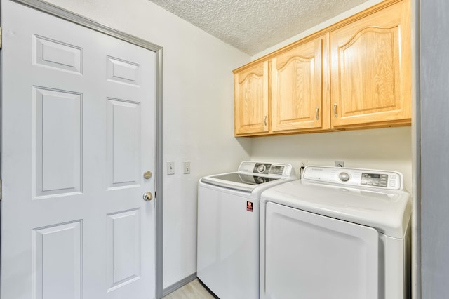 202 N Harper Ave, Springfield, MO 65802 - washroom featuring washing machine and clothes dryer, cabinet space, and a textured ceiling
