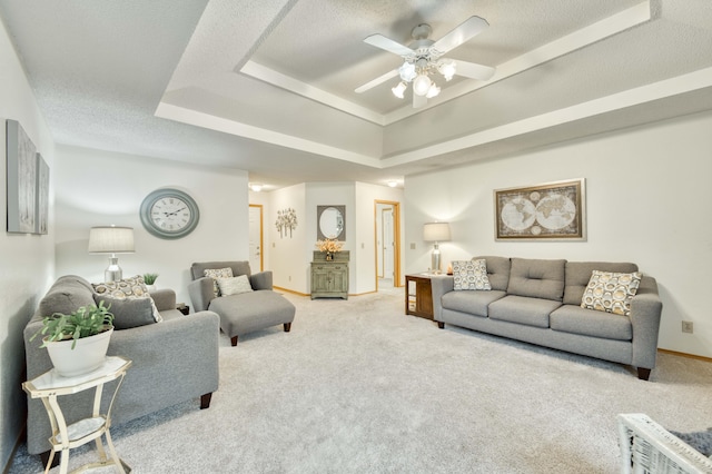 202 N Harper Ave, Springfield, MO 65802 - living area with a tray ceiling, light colored carpet, ceiling fan, and a textured ceiling