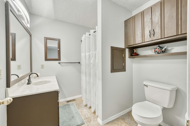 202 N Harper Ave, Springfield, MO 65802 - bathroom with vanity, a textured ceiling, a shower with shower curtain, and tile patterned floors