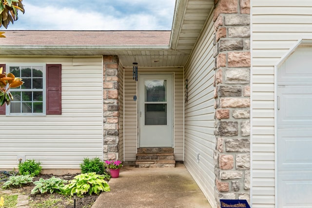 1708 Tiffany St, West Plains, MO 65775 - entrance to property with a garage and stone siding