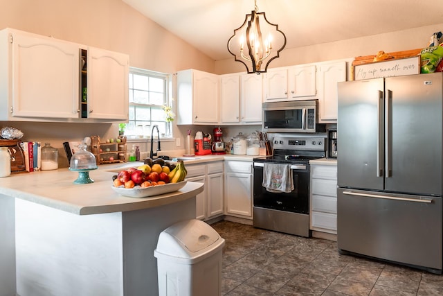 1708 Tiffany St, West Plains, MO 65775 - kitchen featuring stainless steel appliances, a peninsula, white cabinetry, light countertops, and a chandelier