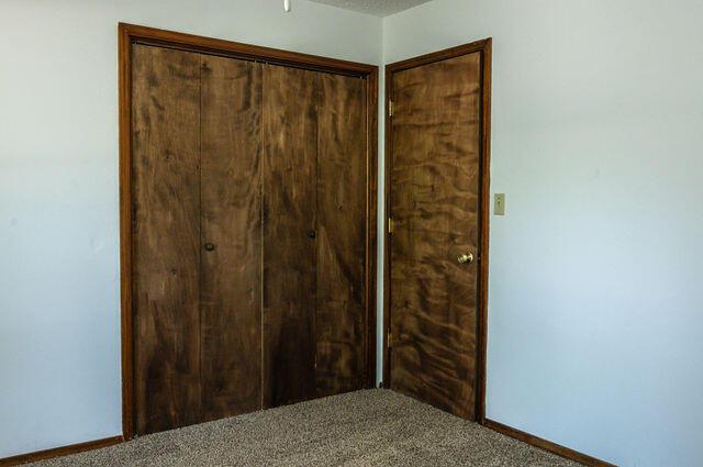 2812 W Maplewood St, Springfield, MO 65807 - unfurnished bedroom featuring carpet flooring and a closet