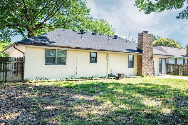 2812 W Maplewood St, Springfield, MO 65807 - rear view of property featuring a chimney